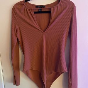 Burnt orange body suit